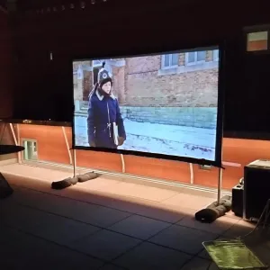 A 100-inch freestanding movie screen setup for the Copper Package.